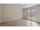 Spacious carpeted bedroom with ample natural light from a large window at 101 Pickett Ln, Cary, NC 27511