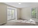Bright bedroom with large windows providing natural light at 101 Pickett Ln, Cary, NC 27511