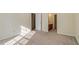 Carpeted bedroom featuring access to the ensuite bath, ample light from back windows at 101 Pickett Ln, Cary, NC 27511