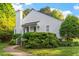Charming white home with lush landscaping and prominent chimney at 101 Pickett Ln, Cary, NC 27511