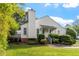 Charming white home featuring a prominent chimney and lush landscaping at 101 Pickett Ln, Cary, NC 27511