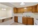 Functional kitchen featuring wood cabinets and a breakfast bar pass-through at 101 Pickett Ln, Cary, NC 27511
