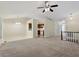 Open-concept living room with neutral color palette and access to other rooms at 101 Pickett Ln, Cary, NC 27511