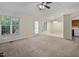 Spacious living area with abundant natural light and access to the kitchen at 101 Pickett Ln, Cary, NC 27511