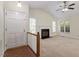 Inviting living room featuring a fireplace and ample natural light at 101 Pickett Ln, Cary, NC 27511