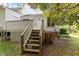 Back entrance with wooden staircase and door, surrounded by trees at 101 Pickett Ln, Cary, NC 27511