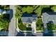 An aerial view of a home with a well-manicured lawn, mature trees, and a paved driveway at 101 Worsham Dr, Chapel Hill, NC 27516