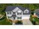 An overhead view of a two-story house featuring gray siding, dark shutters, and a well-kept lawn at 101 Worsham Dr, Chapel Hill, NC 27516