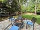 Inviting backyard patio with a fire pit surrounded by comfortable seating, perfect for enjoying cozy evenings outdoors at 101 Worsham Dr, Chapel Hill, NC 27516