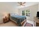 Bedroom featuring a natural wood bed frame, neutral walls, and a bright window view at 101 Worsham Dr, Chapel Hill, NC 27516