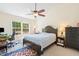 Comfortable bedroom with a ceiling fan, a desk, and a window overlooking the neighborhood at 101 Worsham Dr, Chapel Hill, NC 27516