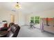Spacious bonus room with a ceiling fan and a comfortable seating area and natural light at 101 Worsham Dr, Chapel Hill, NC 27516