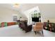 Upstairs bonus room with vaulted ceilings, natural light, and media center with seating at 101 Worsham Dr, Chapel Hill, NC 27516