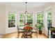 Cozy breakfast nook with large windows offering a view of the lush greenery at 101 Worsham Dr, Chapel Hill, NC 27516