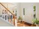 Bright foyer with hardwood floors, staircase and entry to the dining room at 101 Worsham Dr, Chapel Hill, NC 27516