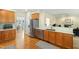 Open kitchen featuring stainless steel appliances, wood cabinets, and breakfast bar at 101 Worsham Dr, Chapel Hill, NC 27516