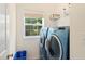 Functional laundry room with modern washer and dryer, and a window for natural light at 101 Worsham Dr, Chapel Hill, NC 27516
