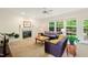 Inviting living room with a cozy fireplace and ample natural light from the windows at 101 Worsham Dr, Chapel Hill, NC 27516
