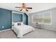 Bright bedroom featuring a murphy bed, carpet and a bench beneath the window at 1016 Pemberly Ave, Morrisville, NC 27560