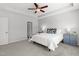 Bedroom featuring a ceiling fan, tray ceiling, neutral paint, carpet, and a window for lots of light at 1016 Pemberly Ave, Morrisville, NC 27560