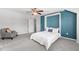 Cozy bedroom features a murphy bed, ceiling fan, chair and neutral carpet at 1016 Pemberly Ave, Morrisville, NC 27560
