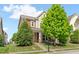 Charming two-story home with a well-manicured lawn and inviting front porch at 1016 Pemberly Ave, Morrisville, NC 27560