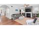 Comfortable living room with a fireplace, neutral tones, and hardwood floors at 1016 Pemberly Ave, Morrisville, NC 27560
