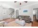 Cozy living room with an archway, hardwood floors, and comfortable seating at 1016 Pemberly Ave, Morrisville, NC 27560