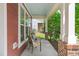 Relaxing porch featuring chairs and a view of a well-maintained yard at 1016 Pemberly Ave, Morrisville, NC 27560
