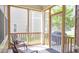 Relaxing screened porch with comfortable seating and outdoor views at 1016 Pemberly Ave, Morrisville, NC 27560