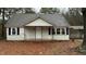 Exterior of a cozy single-story house, showcasing the front porch and classic design at 107 E Underwood Ave, Smithfield, NC 27577
