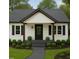 Lovely single-story home with a modern gray-themed porch and lush green lawn at 107 E Underwood Ave, Smithfield, NC 27577