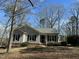 Charming one-story home with gray siding and a well-maintained front yard at 110 Woodland Ridge Dr, Fuquay Varina, NC 27526