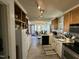 Traditional-style kitchen featuring white cabinets and appliances at 110 Woodland Ridge Dr, Fuquay Varina, NC 27526