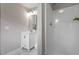 Bright bathroom featuring a white vanity, a framed mirror, and a walk-in shower at 1100 Pecan Pl, Durham, NC 27704