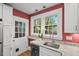 Kitchen featuring granite counters, stainless steel dishwasher, and a white door to the exterior at 1113 Alabama Ave, Durham, NC 27705