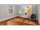 Bright living room featuring hardwood floors, light gray walls, and modern design at 1113 Alabama Ave, Durham, NC 27705