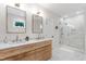 Bright bathroom features a marble-top double vanity and glass-enclosed shower with tile surround at 112 Meadowbrook Dr, Chapel Hill, NC 27514