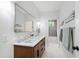 Bathroom featuring double sink vanity, sleek mirror, and bath tub shower combo at 112 Meadowbrook Dr, Chapel Hill, NC 27514