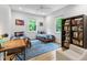 Bright bedroom featuring two twin beds, a desk, and a bookcase with natural light at 112 Meadowbrook Dr, Chapel Hill, NC 27514