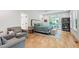 Relaxing main bedroom features light hardwood floors, natural light, and a cozy sitting area at 112 Meadowbrook Dr, Chapel Hill, NC 27514