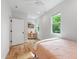 Cozy bedroom with natural light, a desk area, and hardwood floors at 112 Meadowbrook Dr, Chapel Hill, NC 27514