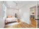 Bright bedroom with a queen bed, hardwood floors, and a walk-in closet at 112 Meadowbrook Dr, Chapel Hill, NC 27514