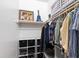 Organized walk-in closet with shelves, hanging rods, and storage bins at 112 Meadowbrook Dr, Chapel Hill, NC 27514