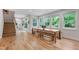 Bright dining area with hardwood floors, a wooden table and a view of the backyard at 112 Meadowbrook Dr, Chapel Hill, NC 27514