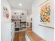 Bright hallway with built-in storage, hardwood floors, and stylish wall decor at 112 Meadowbrook Dr, Chapel Hill, NC 27514