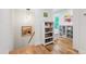 Hallway boasts an open staircase and custom shelving at 112 Meadowbrook Dr, Chapel Hill, NC 27514