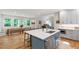 Bright kitchen with a center island, stainless steel appliances, and a breakfast nook with natural light at 112 Meadowbrook Dr, Chapel Hill, NC 27514