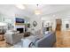 Open concept living room featuring hardwood floors, modern furniture, and a cozy fireplace at 112 Meadowbrook Dr, Chapel Hill, NC 27514