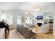 Bright and inviting living room with high ceilings, hardwood floors, and stylish decor at 112 Meadowbrook Dr, Chapel Hill, NC 27514